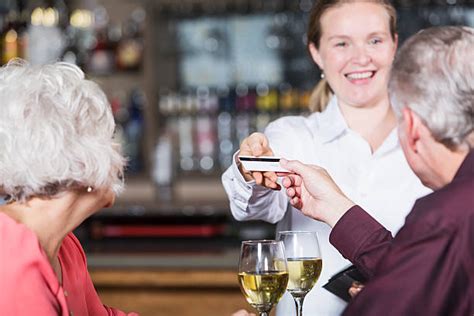 120 Bartender Talking With Female Customer While Working In Restaurant