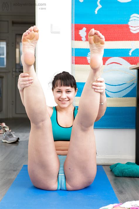 hot sportswoman strips naked and does the plank exercise and split