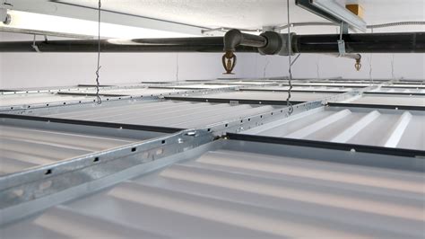 drop  ceiling panels installed beneath fire sprinklers construction canada