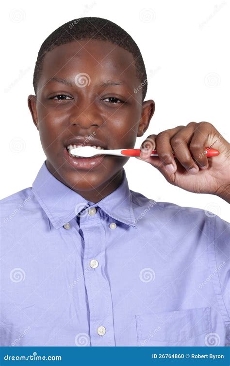 teenage boy brushing teeth stock photo image