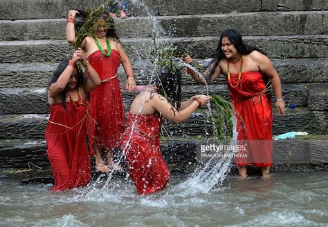 Nepalese Hindu Women Take A Ritual Bath In The Bagmati River During The