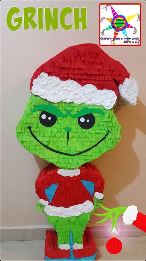 grinch     paper  sits    christmas decoration  santas hat