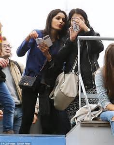 freida pinto is casual but classy in a blue sweater and black leggings