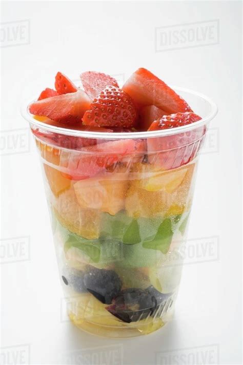 fruit salad   plastic cup stock photo dissolve
