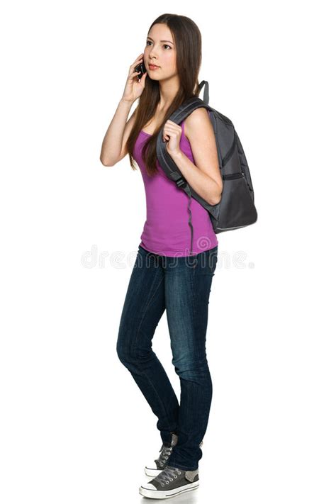 casual teen girl wearing backpack talking on cell phone