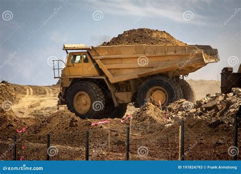 large haul dump truck   construction site filled  dirt stock