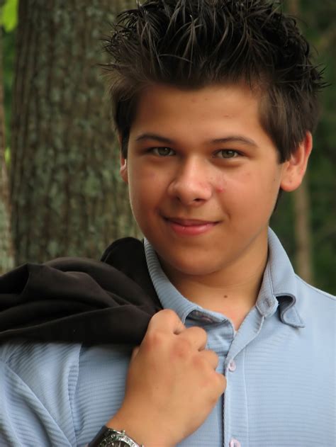 boy teen  stock photo  young latino teen boy posing outdoors   tree