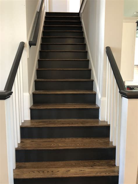stained treads  black risers painted stair risers wood stairs
