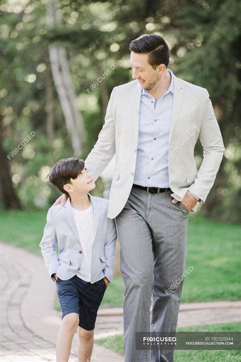 father  son walking  path  garden childhood country
