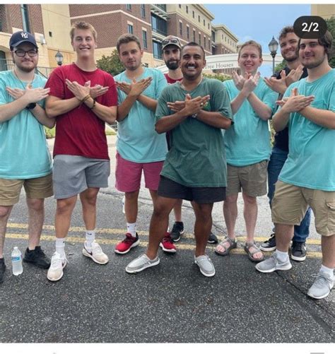 alpha sigma phi brothers flashing  phoenix hand sign fraternity phi