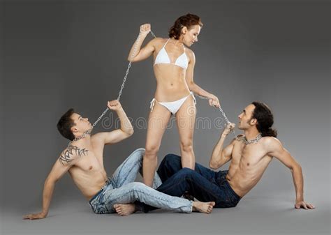 Two Man On Chain For Woman Sexual Games Stock Image