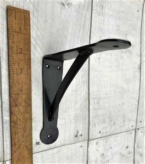 hand forged gallows bracket ornate wood  wax uk supplier