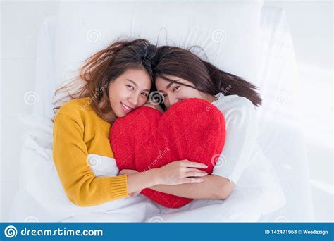 Asia Lesbian Lgbt Couple Lay On Bed And Hug Rainbow Color Pillow Heart