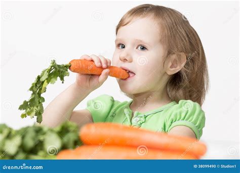 child eats  carrot stock photo image  nutrition food