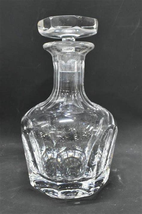 An Orrefors Crystal Decanter With Thumbprint Pattern And Flat Alcohol