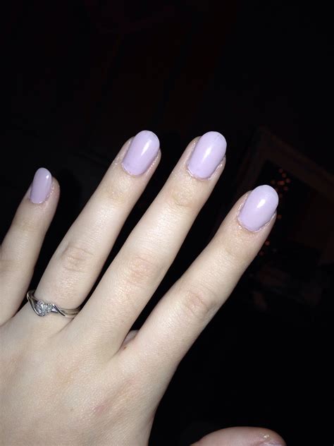 womans hand  pink manies   ring   finger  front