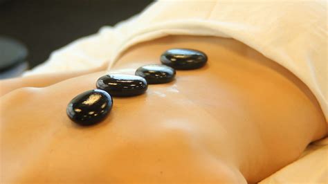 reduce your stress with the help of hot stone massage