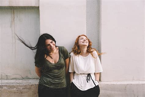 happy real lesbian couple on the street by alexey kuzma