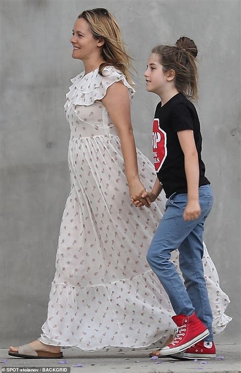 alicia silverstone looks cheerful as she holds hands with her nine year