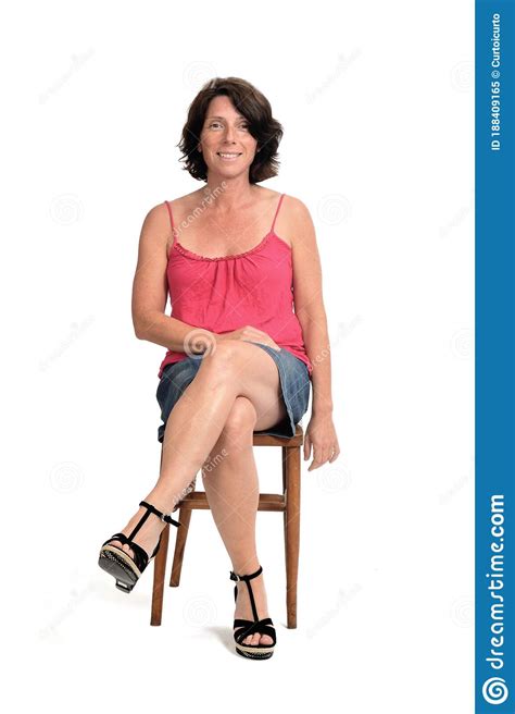 front view woman in skirt sitting on white background