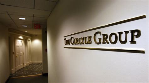 carlyle swoops  wealth manager harwood   deal business news