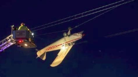 pilot rescued  plane  caught  power lines  shakopee minn fox  minneapolis st