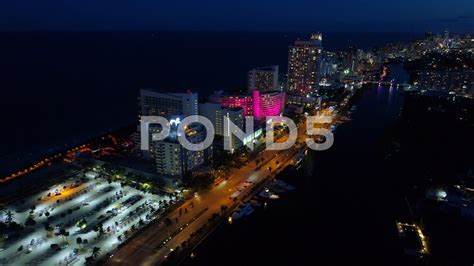 aerial view   city  night  bright lights  tall buildings   background