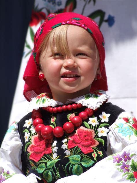 cute little polish girl dressed in Łowiczanka folk costume