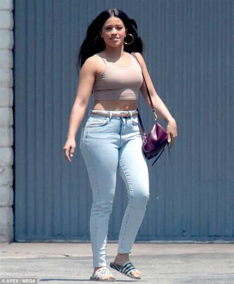gina rodriguez flashes her tummy in nude crop top in la