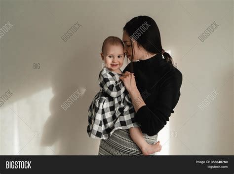 mom holds her daughter image and photo free trial bigstock