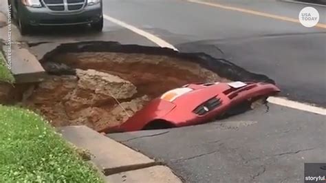 sinkhole opens up in road swallows car
