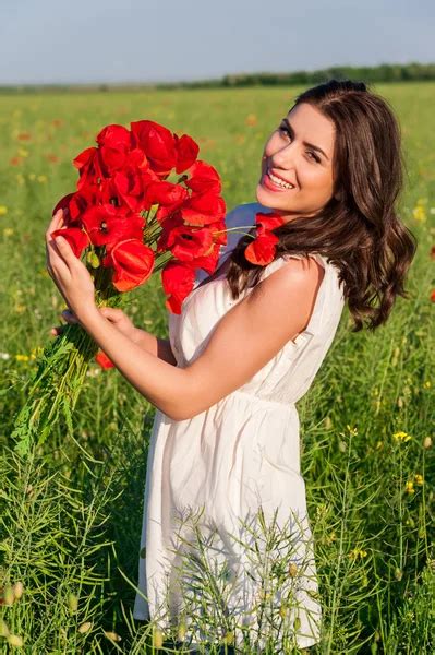 Portrait Of Beautiful Young Woman With Poppies In The Field With A