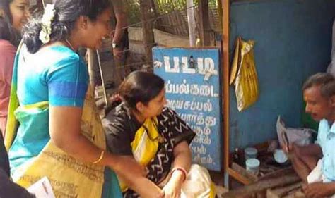 viral photo smriti irani pays rs 100 to cobbler in coimbatore for getting slippers repaired