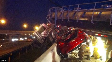 18 Wheeler Truck Dangles Over Interstate And Wedges Car