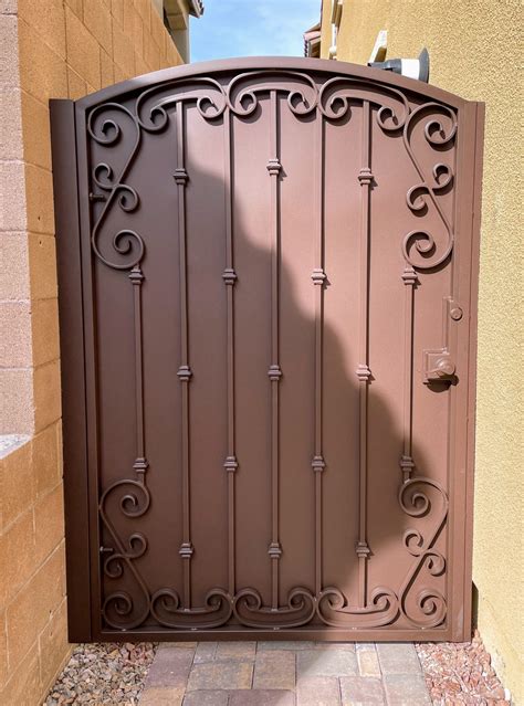 wrought iron gate  solid backing  perforated metal