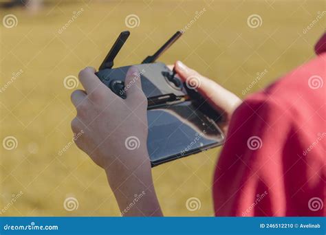 view close  image  flying drone  teenager boy piloting  modern digital drone