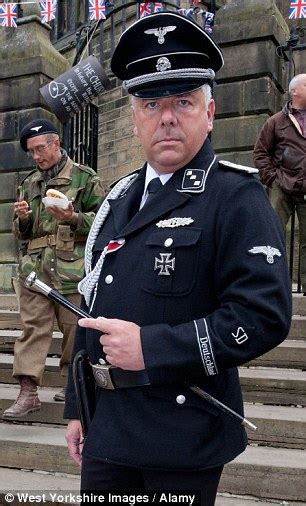 German Delegation Greeted By Revellers In Nazi Uniforms On Visit To