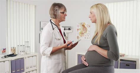 happy doctor talking with pregnant woman stock footage video 7814122 shutterstock