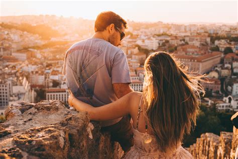 Free Photo Two Women Sitting On Brown Picnic Mat During Sunset