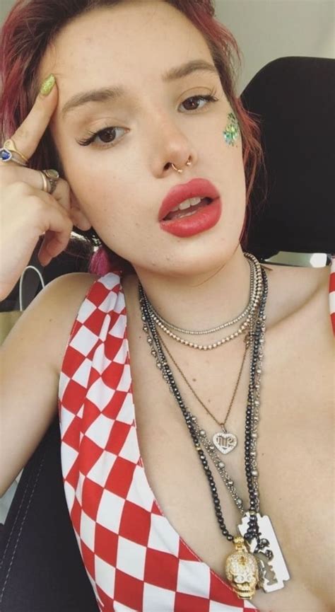 bella thorne just about covers her modesty as she poses