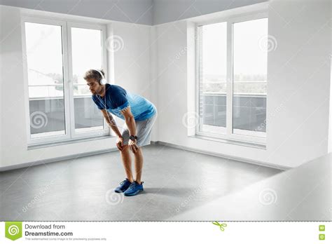 man workout exercises fitness male model exercising indoors stock photo image  exercises