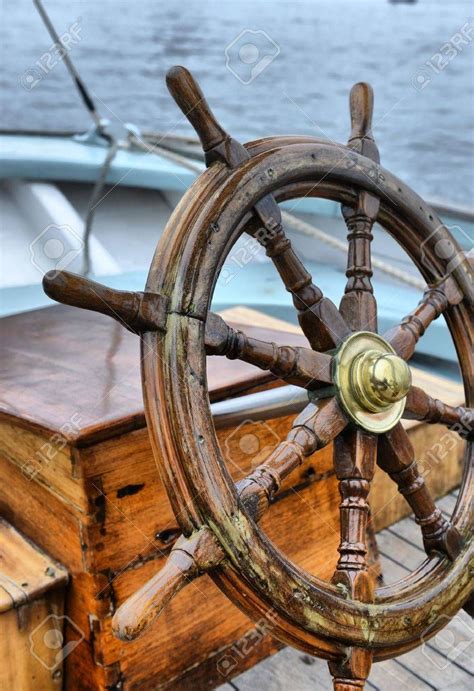 wooden steering wheel   deck   boat