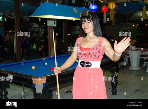 thai prostitute playing pool in a gogo bar chiang mai thailand stock