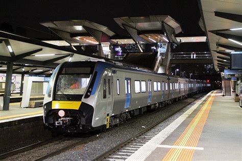 high capacity metro train passes  north melbourne station  night rmelbourne
