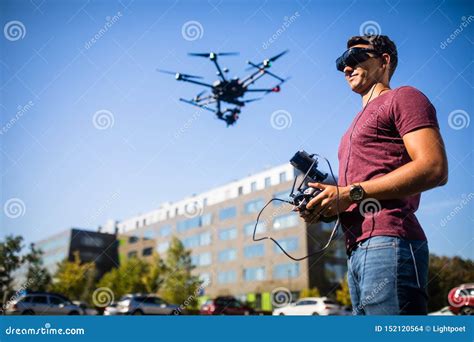 handsome young man flying  drone outdoors stock photo image  pilot flight
