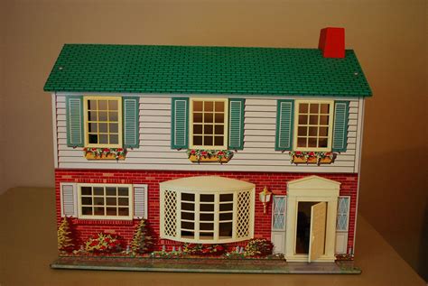 metal two story dollhouse by wolverine 1960s tin litho with furniture