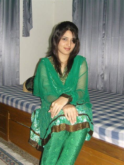 cute smile of a lahori girl in green dress sitting in her