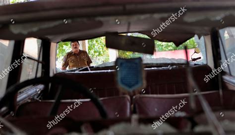 sri lankan police officer inspects car that editorial
