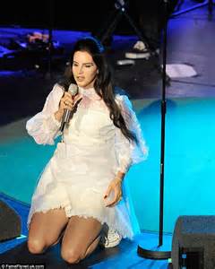 lana del rey performs in a dated lace mini dress and