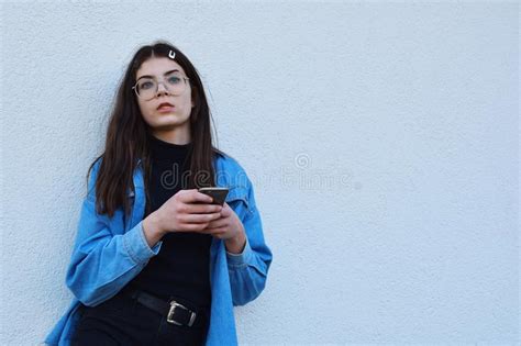 brunette girl using a smartphone stock image image of hair enjoying 30281387